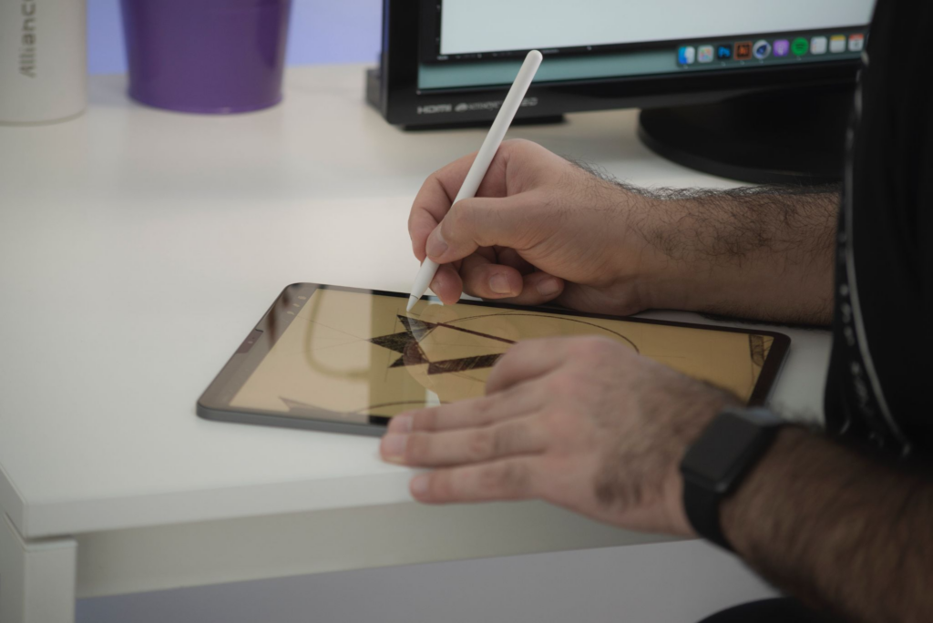 Someone drawing on a tablet